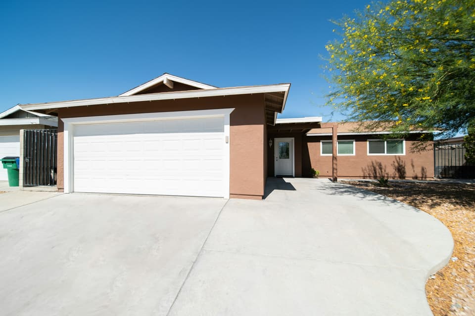 A house with a white sectional garage door